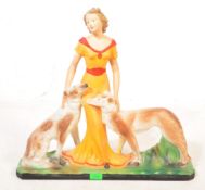 1930S ART DECO PLASTER FIGURE OF A LADY AND DOGS
