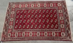 AN EARLY 20TH CENTURY HAND KNOTTED PERSIAN TURKOMAN RUG