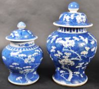GRADUATING PAIR OF CHINESE PRUNUS VASES WITH COVERS