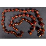 19TH CENTURY CHINESE CARVED AMBER FACE / HEAD BEADS