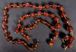 19TH CENTURY CHINESE CARVED AMBER FACE / HEAD BEADS