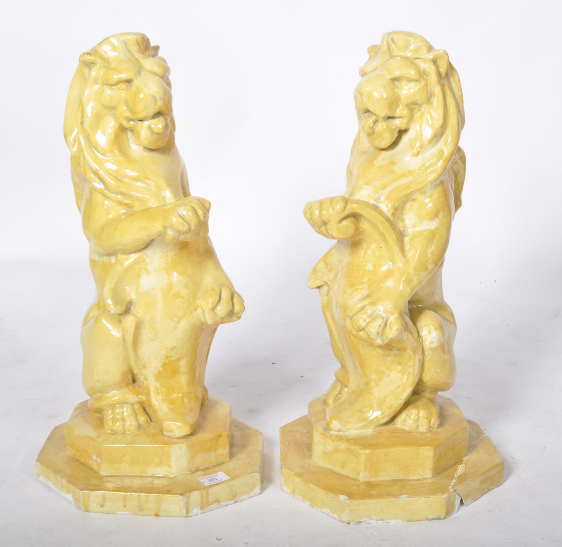 20TH CENTURY MATCHING PAIR OF POTTERY GARDEN LION FIGURES
