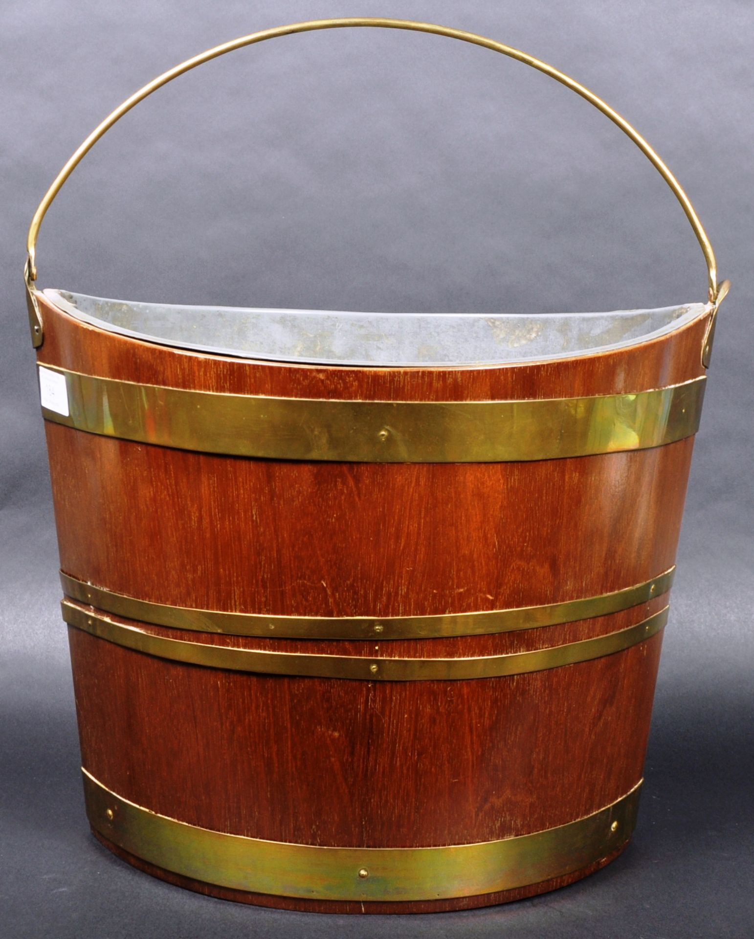 GEORGE III IRISH MAHOGANY AND BRASS NAVETTE PEAT BUCKET