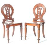 MATCHING PAIR OF VICTORIAN MAHOGANY CARVED HALL CHAIRS