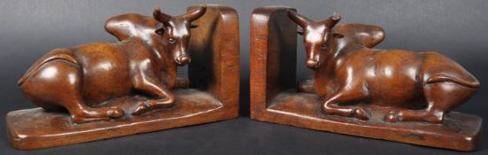 PAIR OF 19TH CENTURY CARVED WALNUT BUFFALO BOOKENDS
