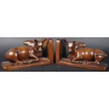 PAIR OF 19TH CENTURY CARVED WALNUT BUFFALO BOOKENDS