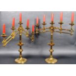 PAIR OF MID 19TH CENTURY GOTHIC BRASS ARTICULATED CANDLESTICKS