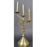 LATE 19TH CENTURY GOTHIC POLISHED BRASS TRIPLE CANDLESTICK
