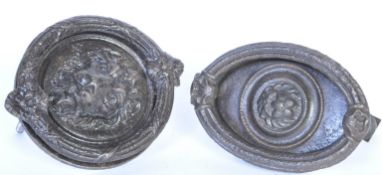 TWO 20TH CENTURY EBONISED CAST METAL KNOCKERS