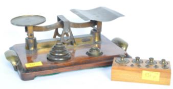 A VINTAGE W & T AVERY BRASS SHOP SCALE WITH WEIGHTS