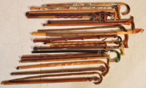LARGE COLLECTION OF VINTAGE WALKING STICKS IN STAND