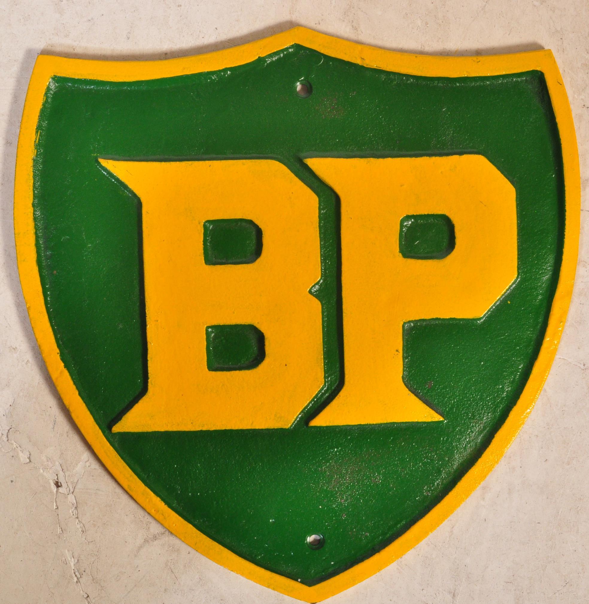 A 20TH CENTURY CAST IRON HAND PAINTED BP PLAQUE