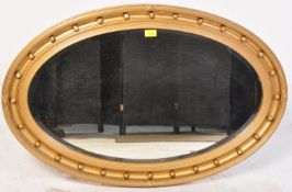 19TH CENTURY VICTORIAN WALL MIRROR OF OVAL FORM
