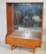 A MID 20TH CENTURY TEAK MIRROR BACK DISPLAY CABINET