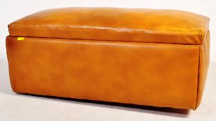 A MID 20TH CENTURY TAN BROWN LEATHER OTTOMAN