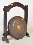 A 19TH CENTURY OAK AND BRONZE THAI CEREMONIAL GONG