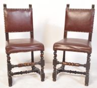 A PAIR OF EDWARDIAN CARVED OAK AND LEATHER DINING CHAIRS