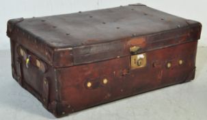 A LARGE EARLY 20TH - CIRCA 1910S - CENTURY LEATHER SUITCASE