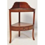 A 19TH CENTURY GEORGE III MAHOGANY CORNER WASHSTAND