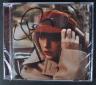 TAYLOR SWIFT - SINGER - AUTOGRAPHED ' RED ' CD - AFTAL