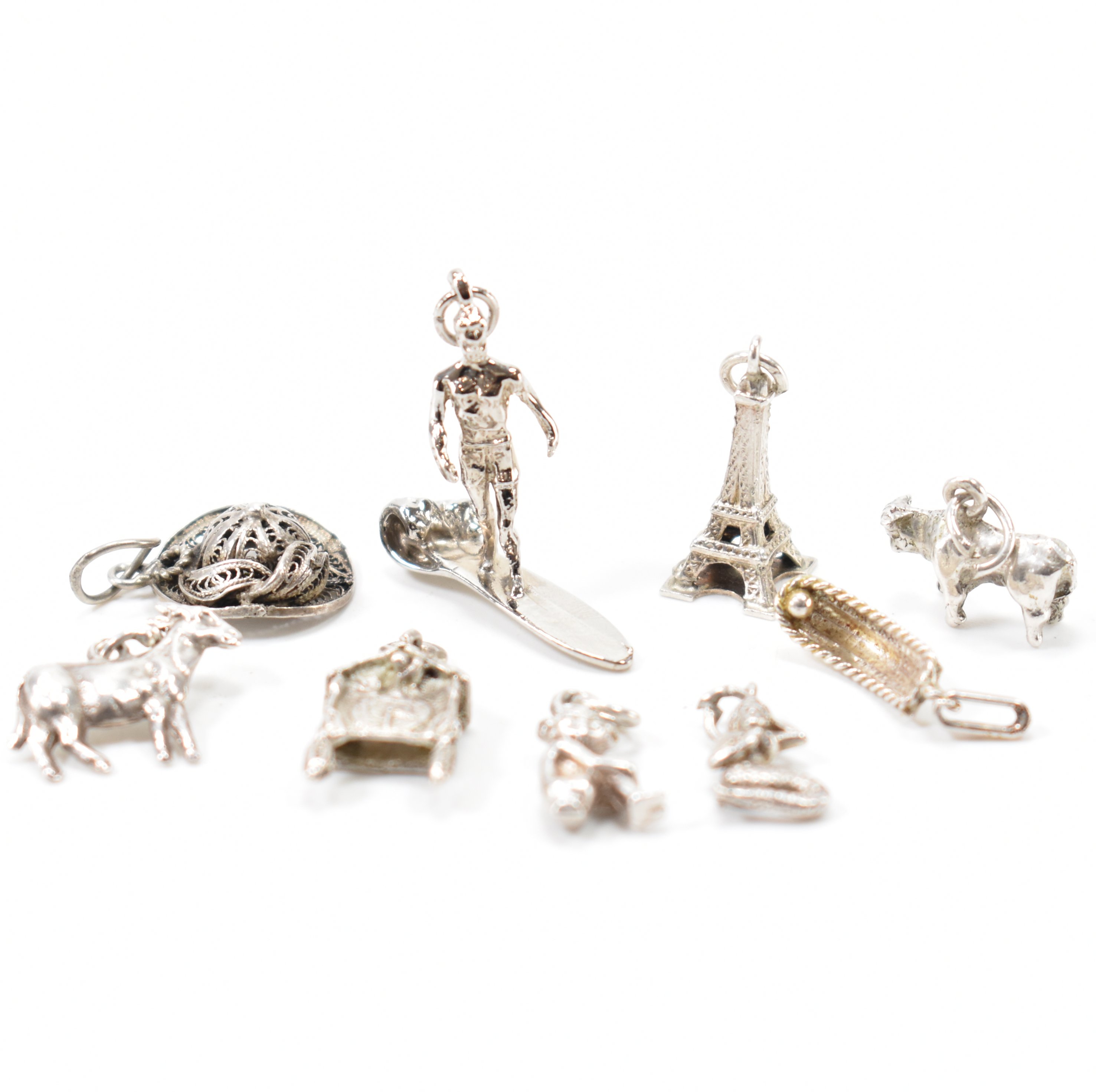 GROUP OF VINTAGE WHITE METAL CHARMS
