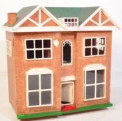 A RETRO VINTAGE FOUR BEDROOM DOLLS HOUSE