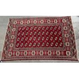 AN EARLY 20TH CENTURY HAND KNOTTED PERSIAN TURKOMAN RUG