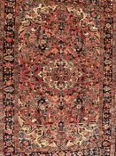 AN EARLY 20TH CENTURY PERSIAN LILIHAN FLOOR RUG