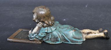 COLD PAINTED BRONZE IN THE FORM OF A YOUNG GIRL