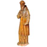 17TH CENTURY CONTINENTAL LIMESTONE FIGURE OF ST ANTONY