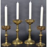 TWO PAIRS OF 19TH CENTURY GOTHIC BRASS CANDLESTICKS