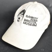 BANKSY - BANKSY VS BRISTOL MUSEUM (2009) - PROMOTIONAL CAP