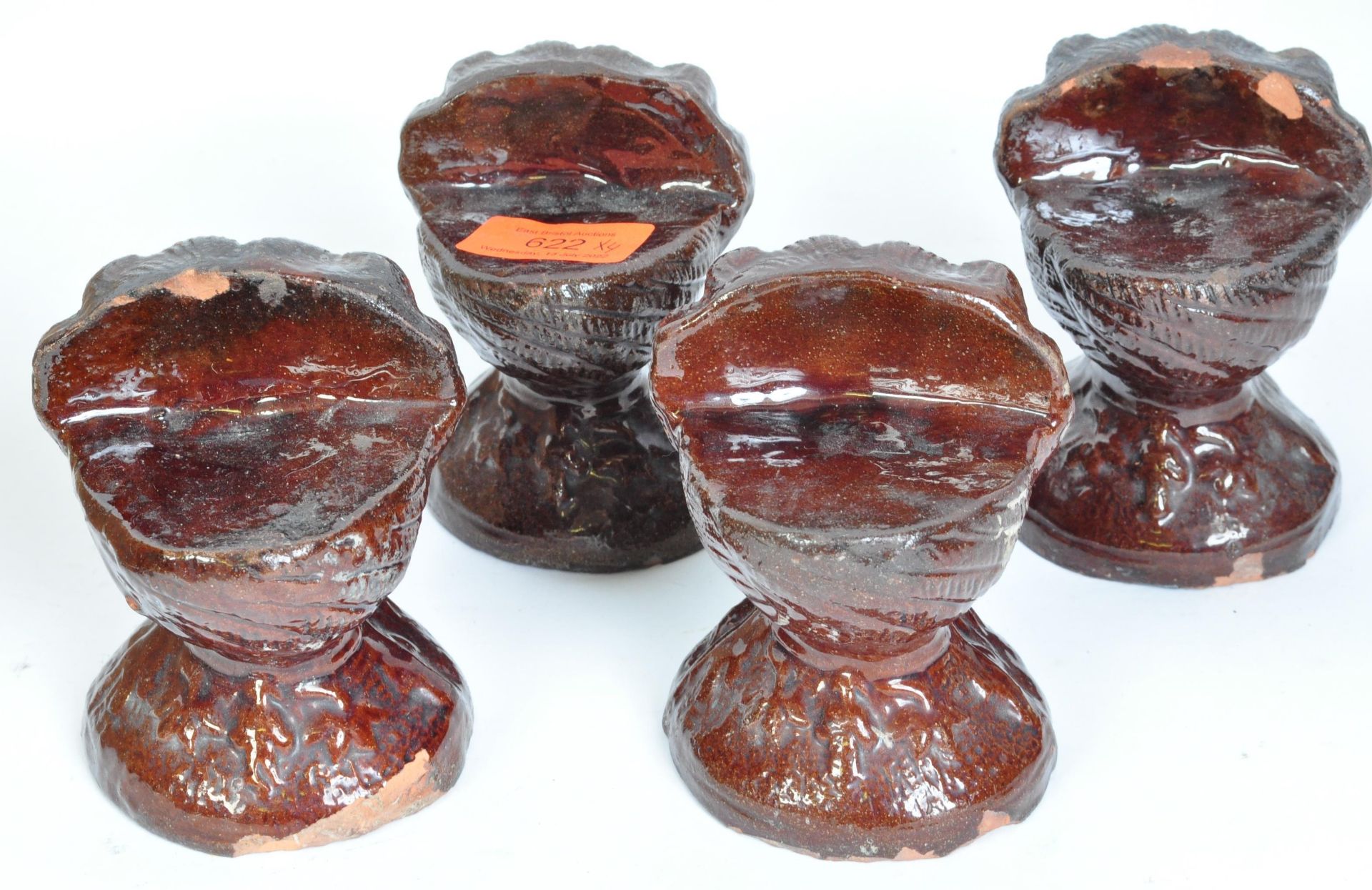 A SET OF FOUR VICTORIAN TREACLE-GLAZED POTTERY SASH WINDOW RESTS - Image 4 of 5