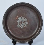 A HUGH WALLIS ARTS & CRAFTS HAND HAMMERED COPPER PLATE