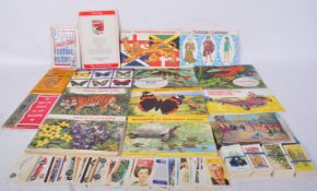 AN ASSORTMENT OF POSTCARDS & CIGARETTE CARDS