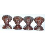 A SET OF FOUR VICTORIAN TREACLE-GLAZED POTTERY SASH WINDOW RESTS