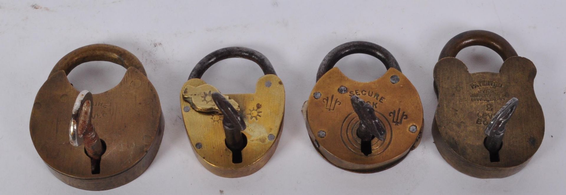 COLLECTION OF FOUR BRASS MINAITURE PADLOCKS