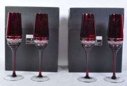 SET OF FOUR JOHN ROCHA FOR WATERFORD CRYSTAL RUBY FLUTE GLASSES