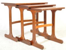 A VINTAGE - CIRCA 1970S - TEAK WOOD NEST OF RECTANGULAR TABLES