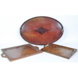 THREE EARLY 20TH CENTURY WOODEN TRAYS