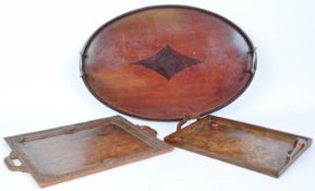 THREE EARLY 20TH CENTURY WOODEN TRAYS