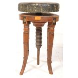 A VICTORIAN MAHOGANY REVOLVING PIANO STOOL OF CIRCULAR FORM