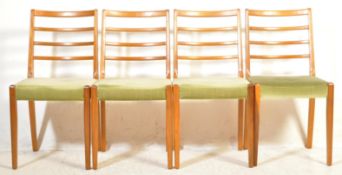 FOUR MID CENTURY TEAK WOOD DINING CHAIRS