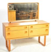 A VINTAGE MID 20TH CENTURY TEAK DRESSING TABLE