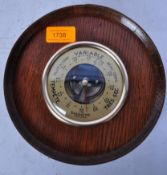 GERAUD LAFITTE - MID CENTURY OAK BRASS BOUND BAROMETER