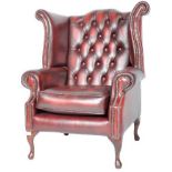 CONTEMPORARY OXBLOOD RED LEATHER WINGBACK ARMCHAIR