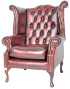 CONTEMPORARY OXBLOOD RED LEATHER WINGBACK ARMCHAIR