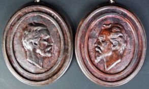 PAIR OF CAST IRON GERMAN CHRISTMAN PLAQUES