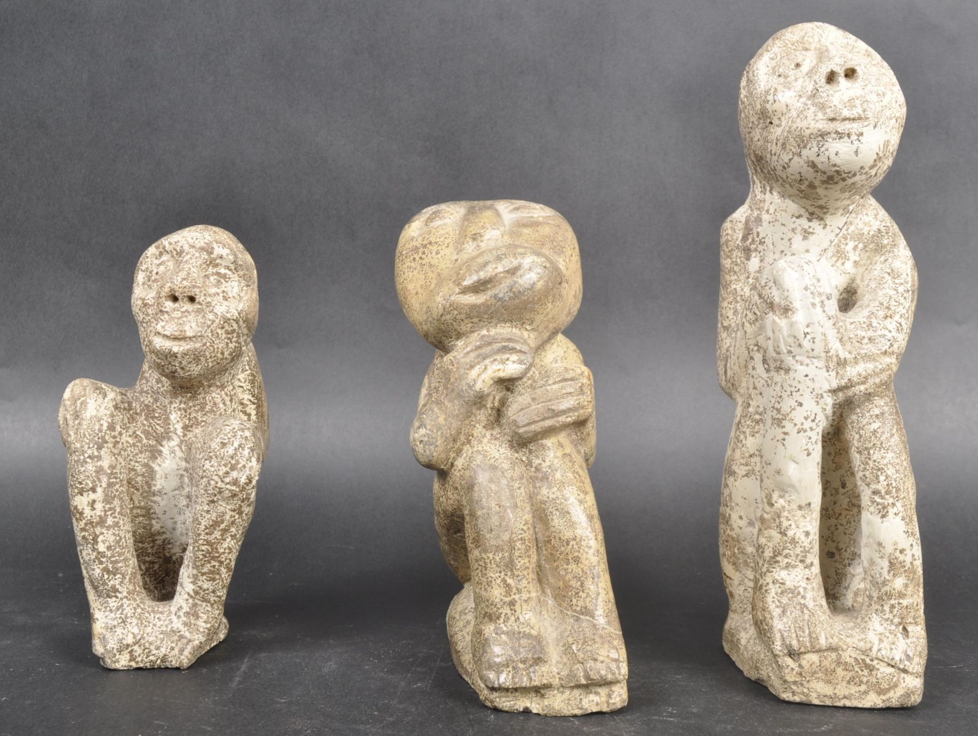 THREE AFRICAN GHANAIAN CARVED STONE FIGURES