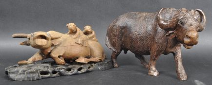 TWO 19TH CENTURY CHINESE CARVED OX FIGURES